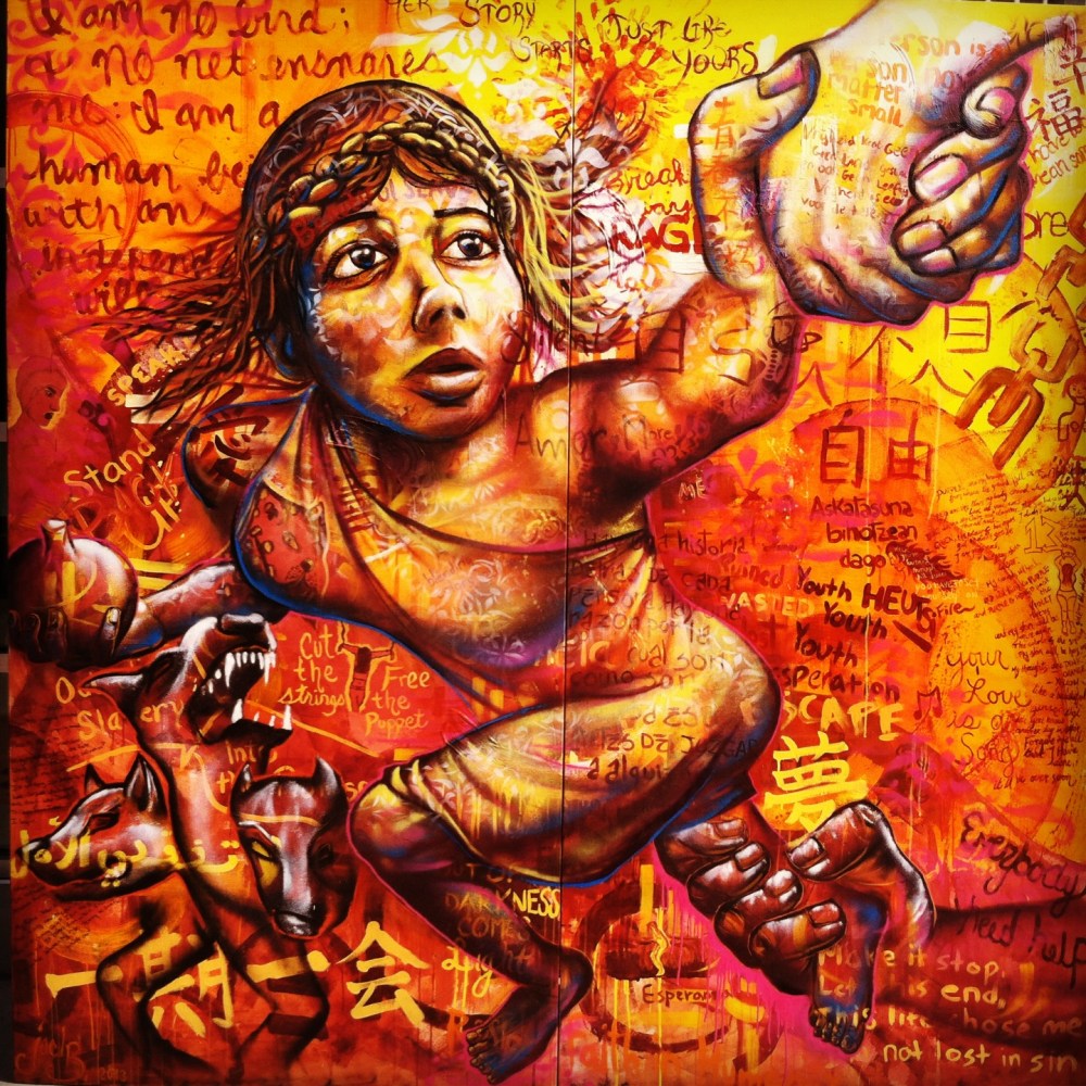 Dayton, OH 2013: This mural was created at the University of Dayton's Art Street center. Joel led workshops with groups of students, including at-risk high school kids, international students and the university's incoming freshmen, all of whom learned about the topic of sex trafficking in the US. They then wrote poetry and painted their reactions to what they learned, all of which formed the fabric of this mural that features the Roman goddess Proserpina, who was abducted by the god of the underworld. The mural was unveiled during Joel's solo exhibition. 